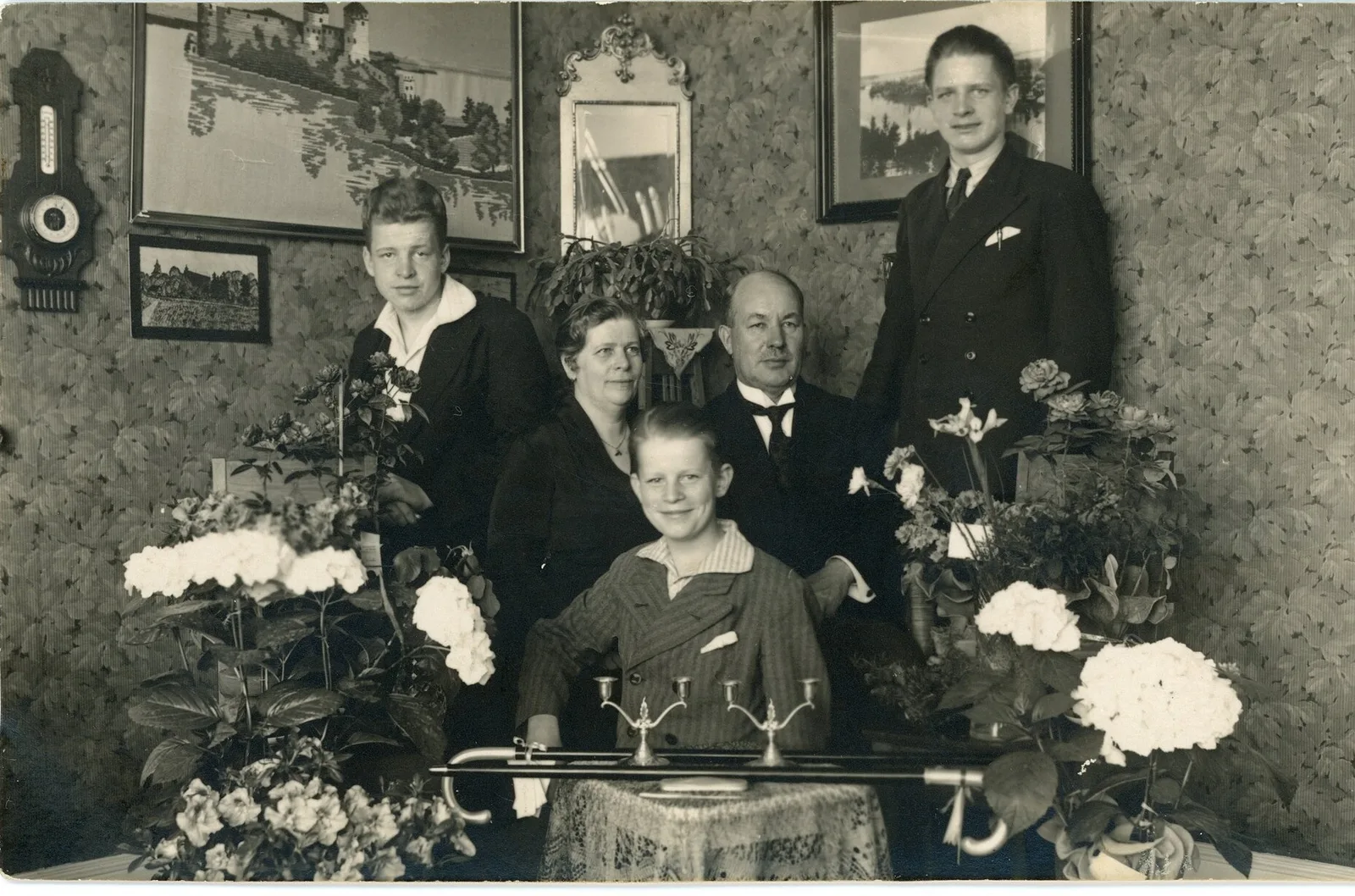 Original: A family of five posed in a parlor among hydrangeas, early 1900s